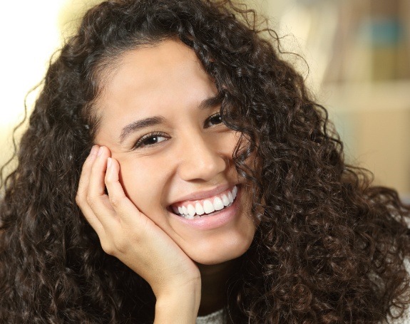 Woman with bright smile after teeth whitening