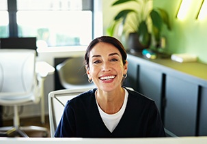 Smiling receptionist in dental office