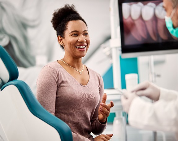 a patient speaking with their dentist