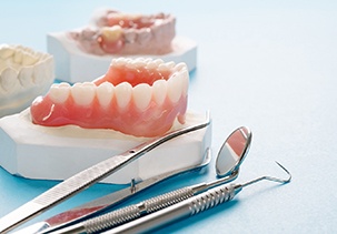 full dentures on a plaster cast of a mouth