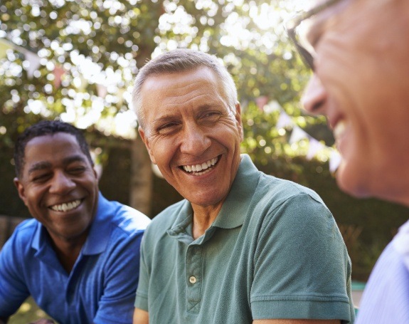 Man smiling and enjoying the benefits of dental implants