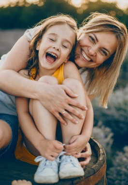 Smiling mother and child after children's dentistry visit