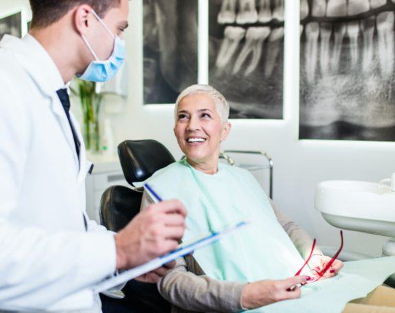 Dentist talking to dental patient