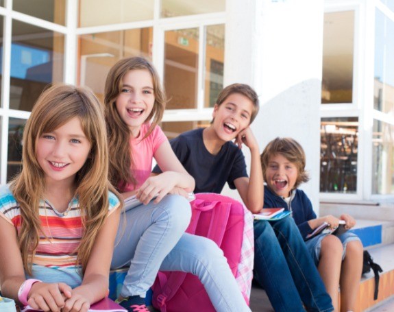 Kids smiling after receiving dental sealants