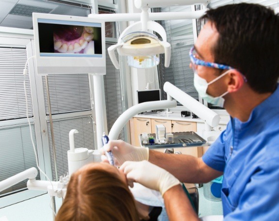 Dentist capturing smile images with intraoral camera