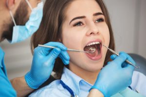 woman getting her teeth cleaned 