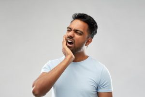 man with jaw pain