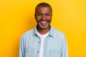 healthy middle-aged man with dental implants